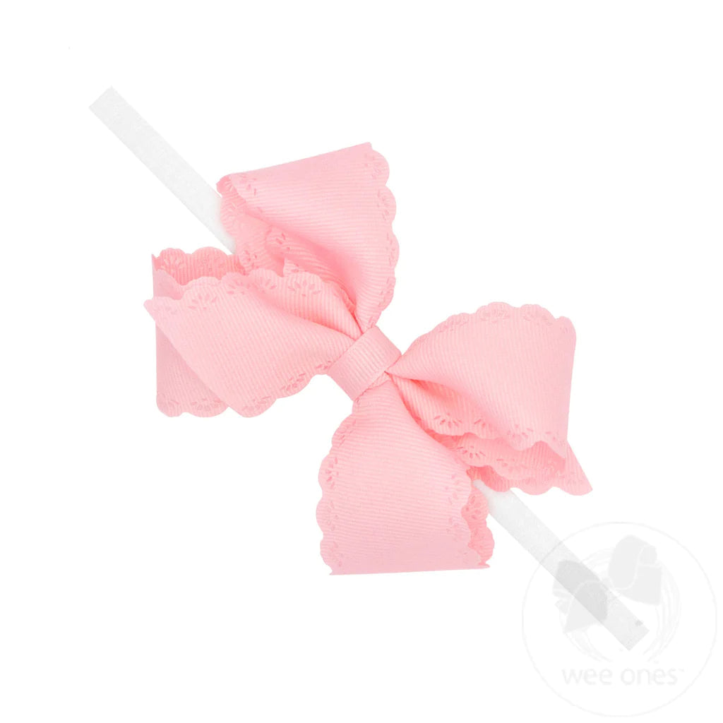 Pink Grosgrain Infant Hair Bow with Eyelet Edge on White Nylon Headband - Small 3M and Up